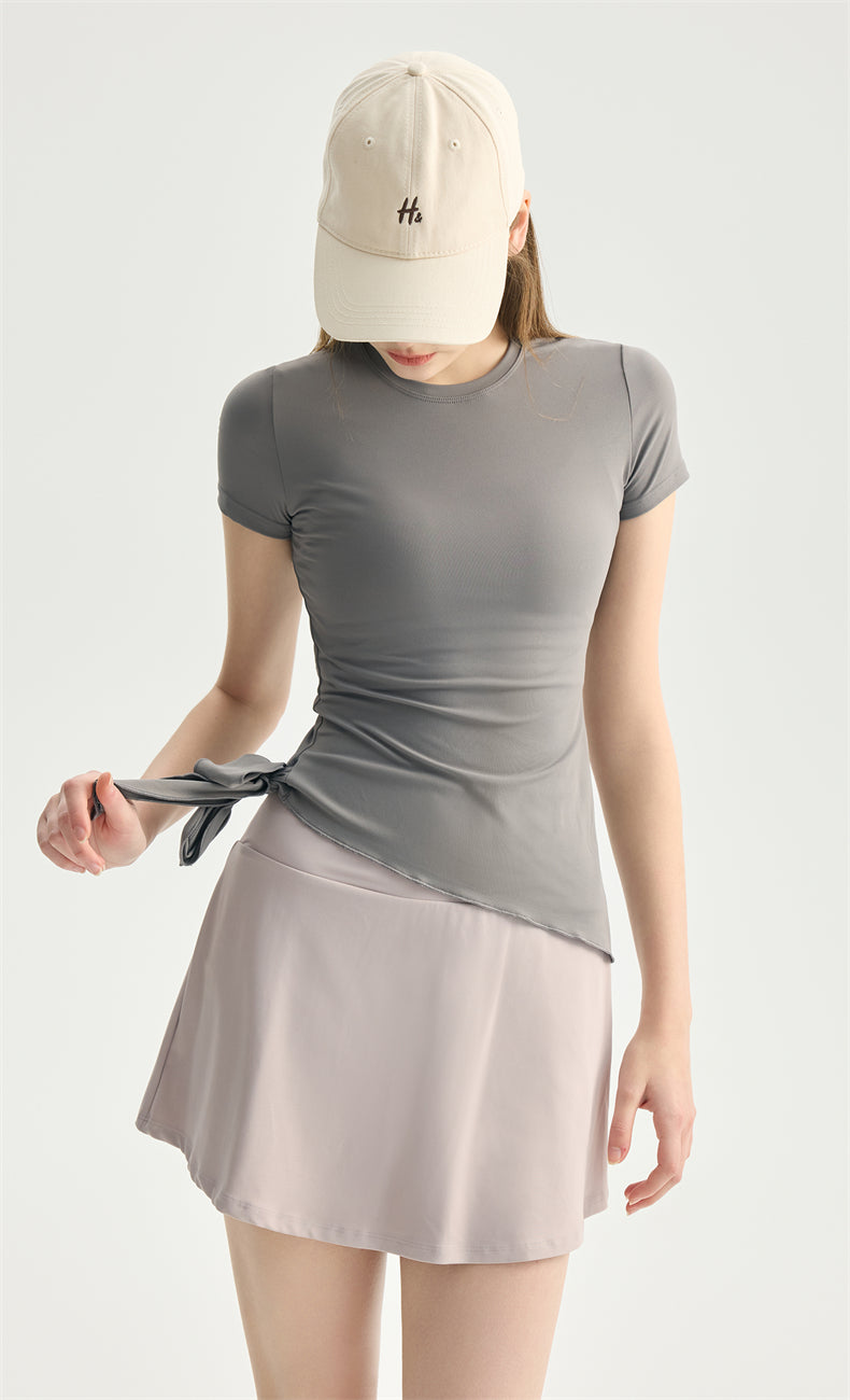 NULS Asymmetrical Side-Tie Yoga Tee movement view - women's yoga activewear by Lepeins